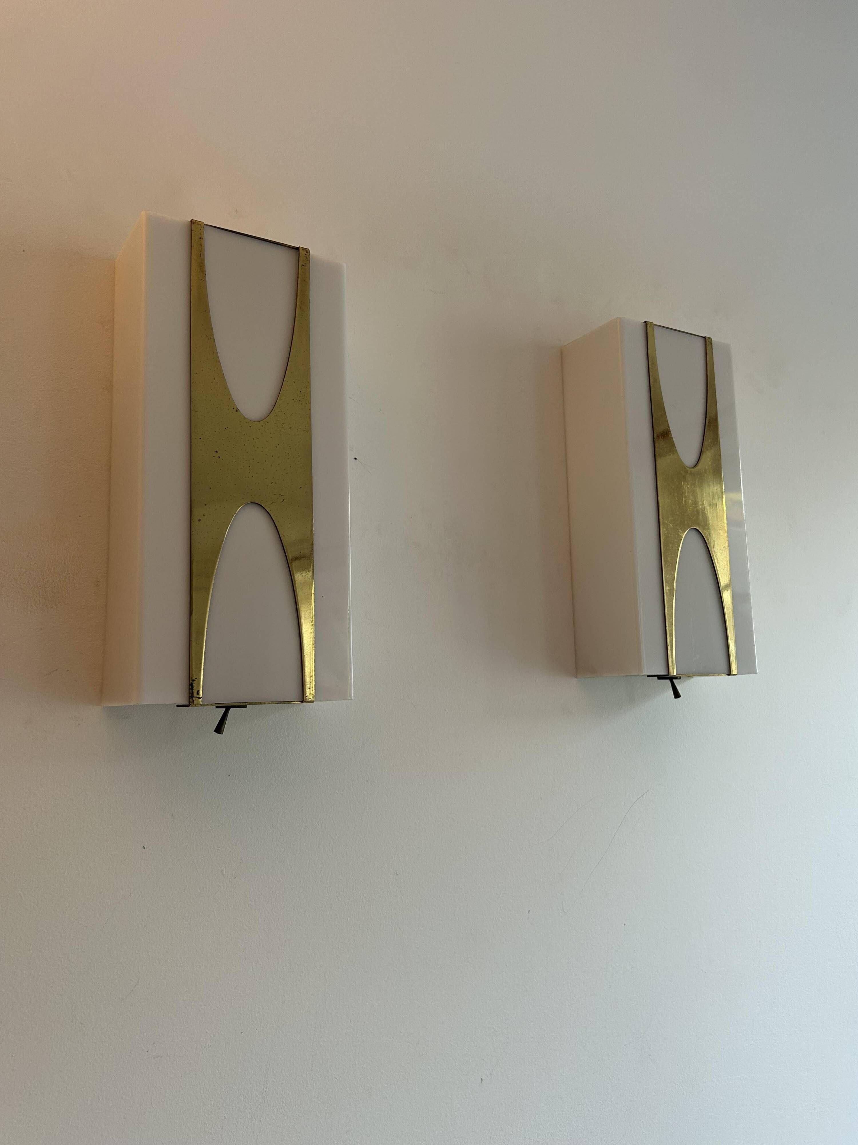 Pair of Loewy wall lights for Hilton, brass and Perspex, France 1965