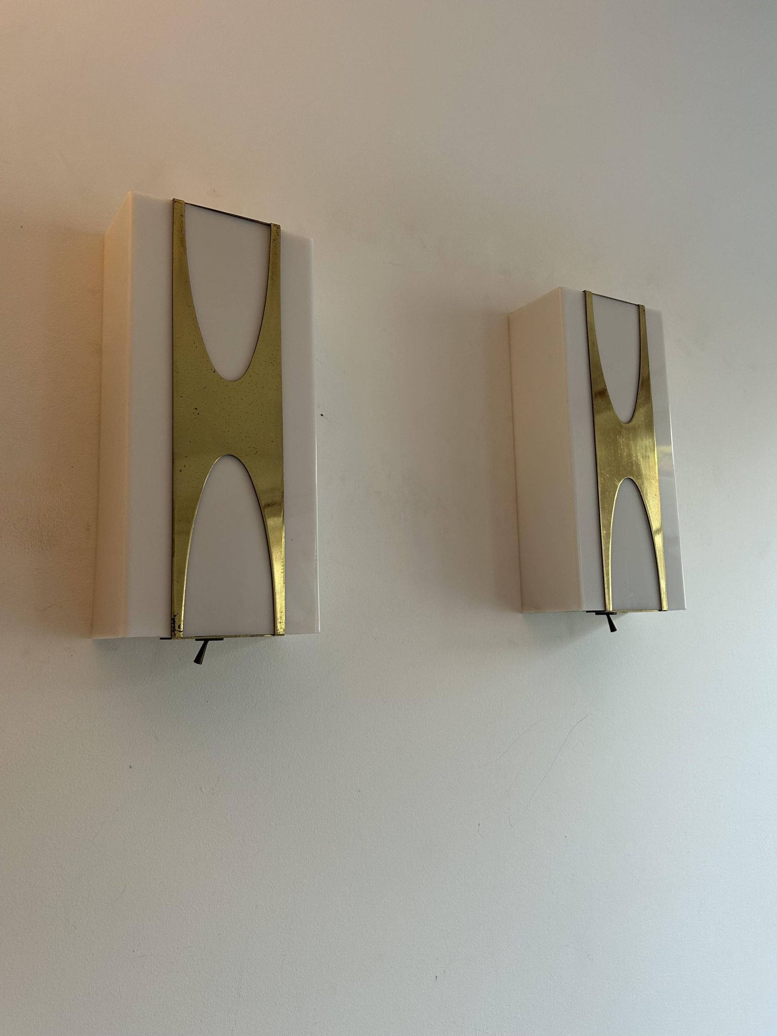 Pair of Loewy wall lights for Hilton, brass and Perspex, France 1965