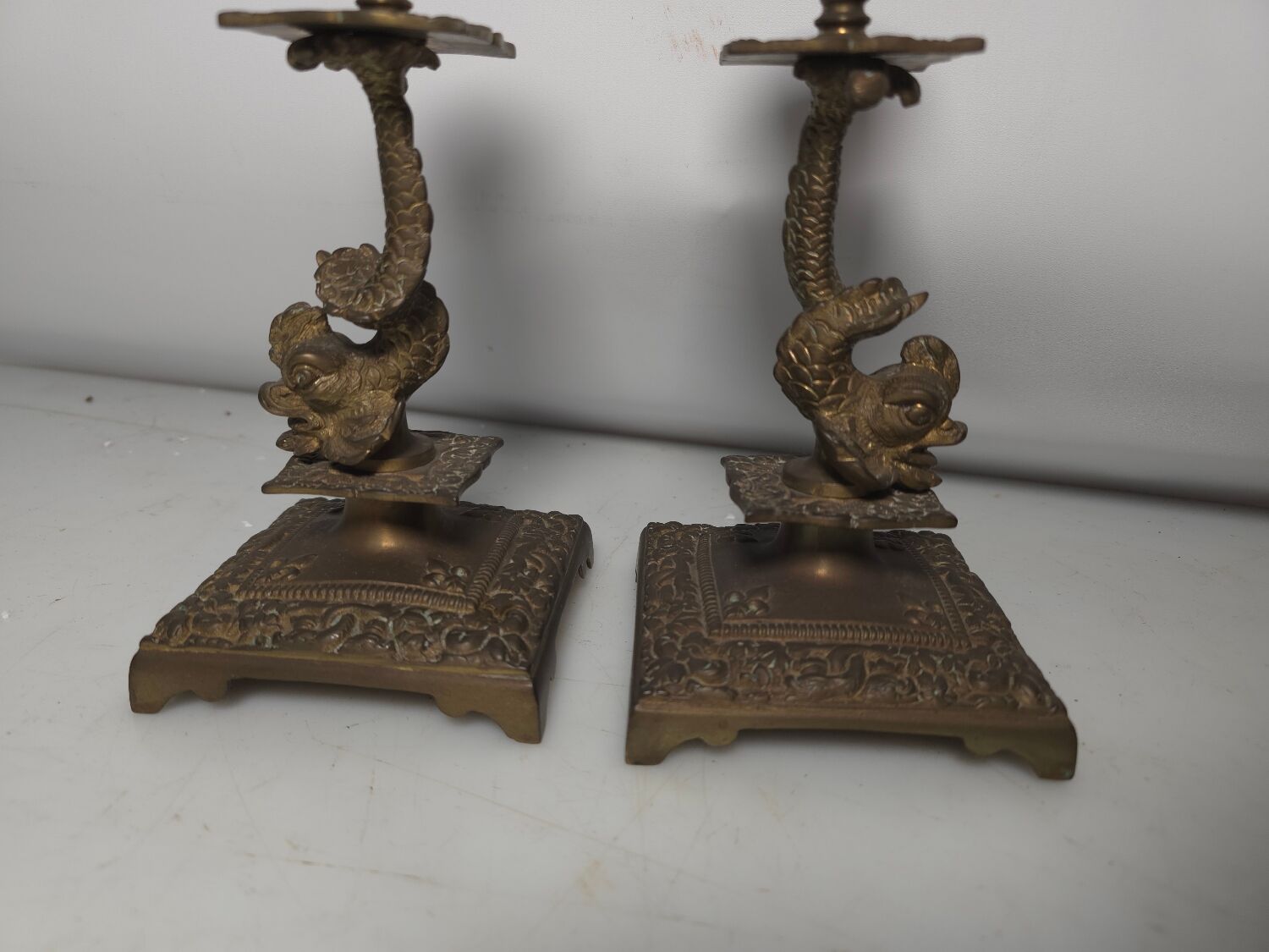 Pair of candlesticks with bronze dolphins