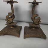 Pair of candlesticks with bronze dolphins