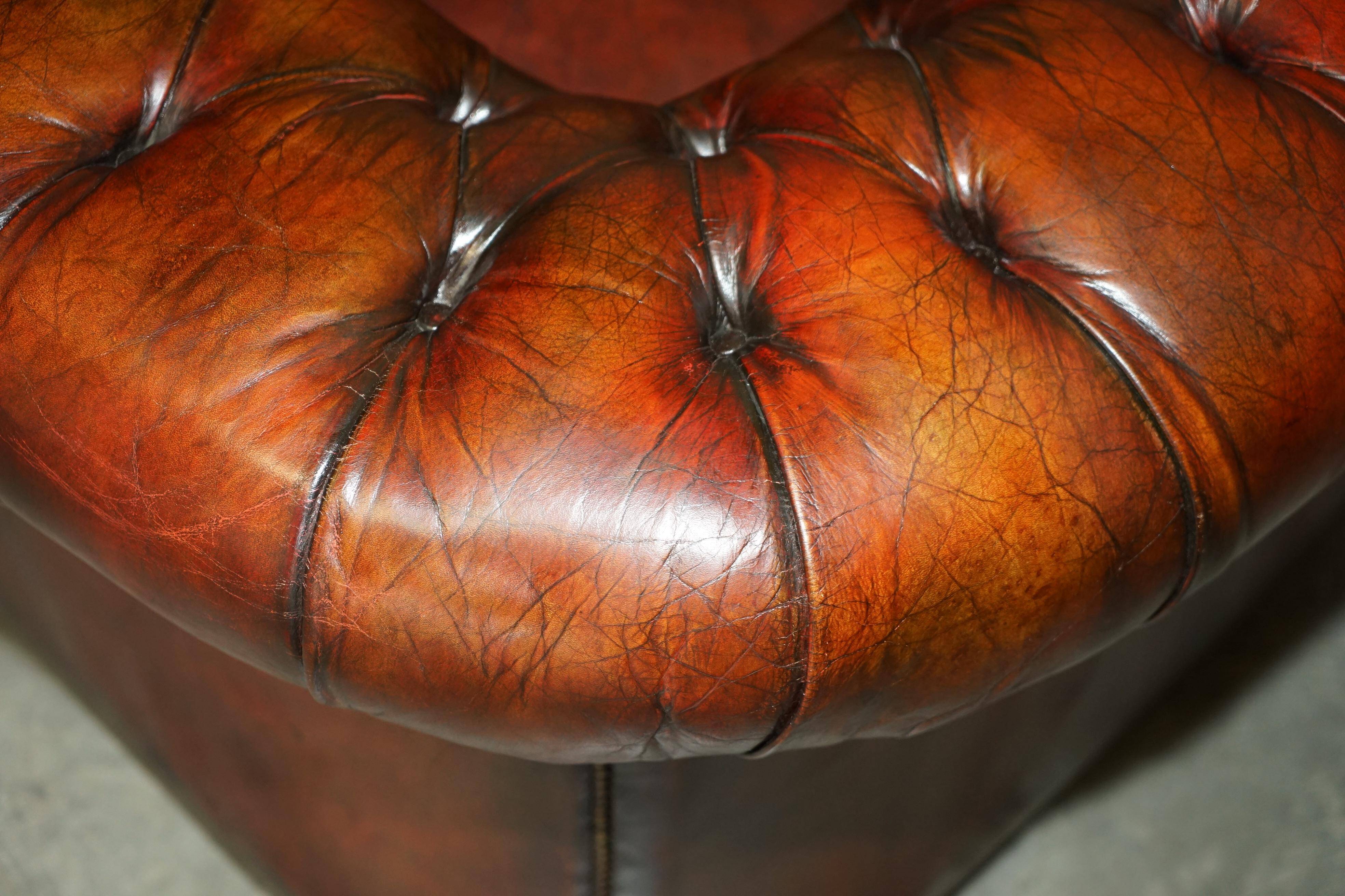 Pair of restored antique Chesterfield sofas in Boudreaux leather.