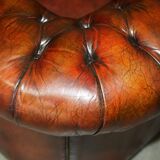 Pair of restored antique Chesterfield sofas in Boudreaux leather.