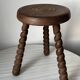 Wooden stool with three twisted legs