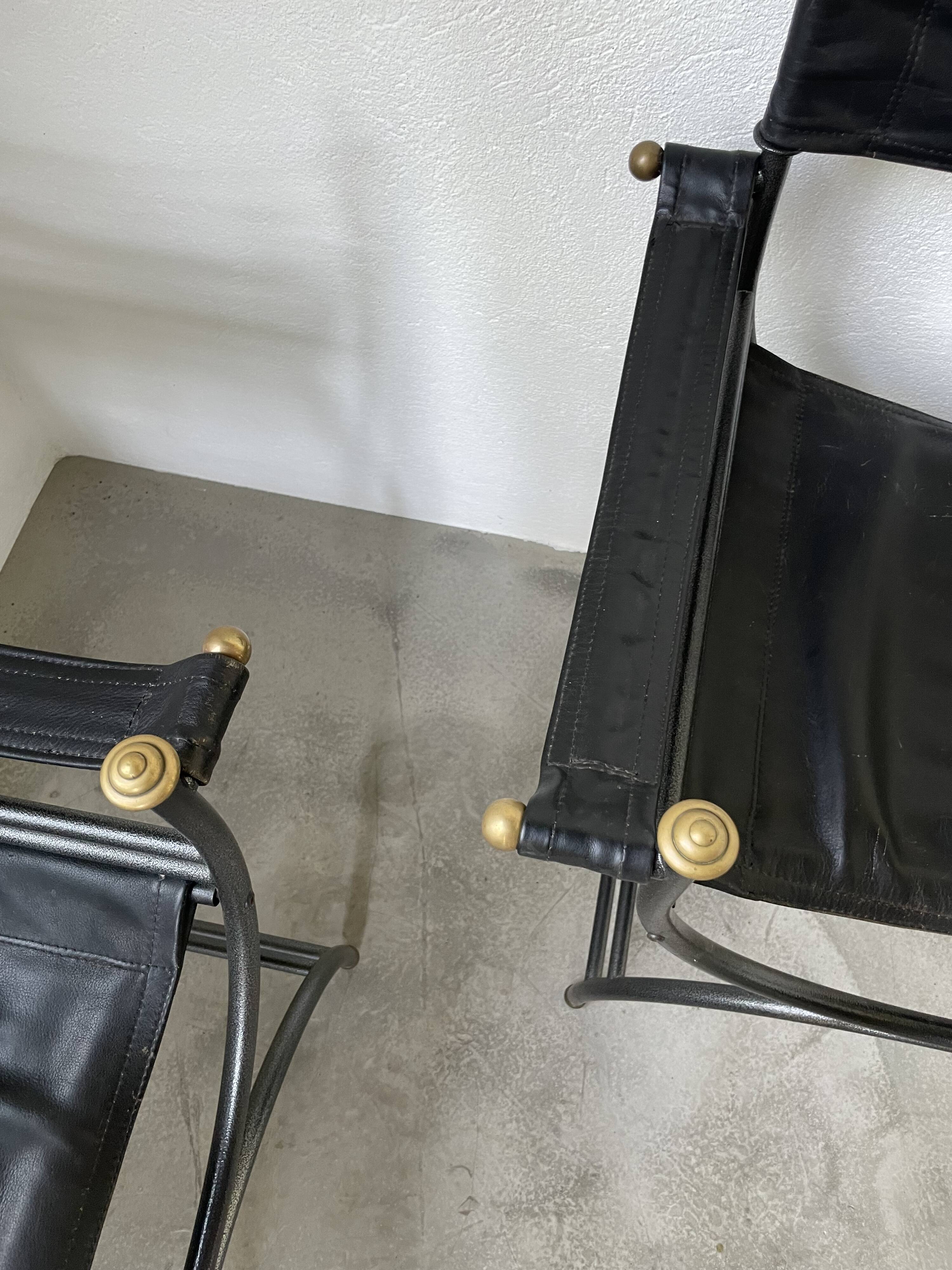 Pair of leather “curule” emperor armchairs