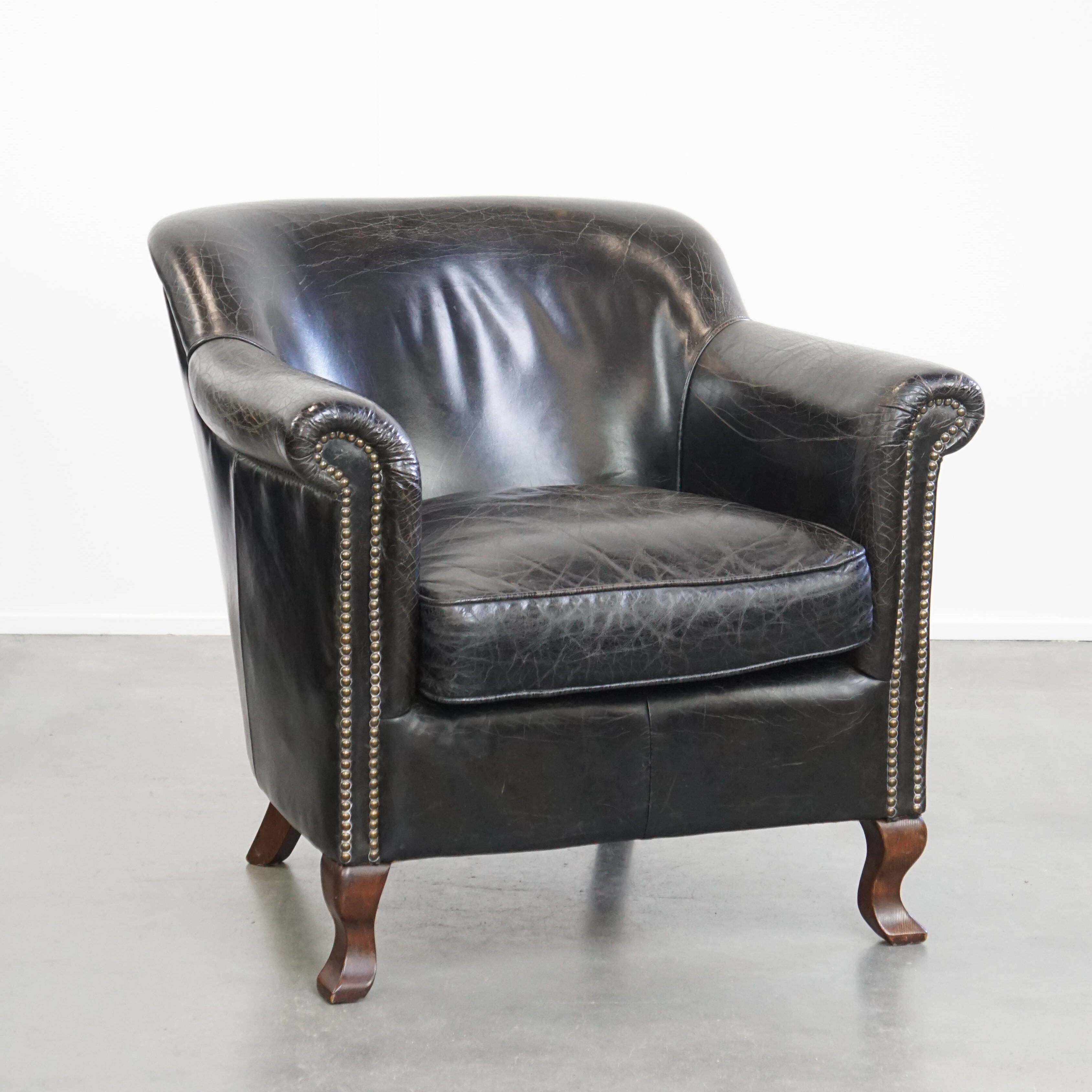 Black grained cowhide leather armchair