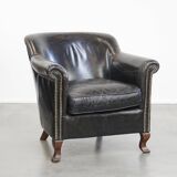 Black grained cowhide leather armchair