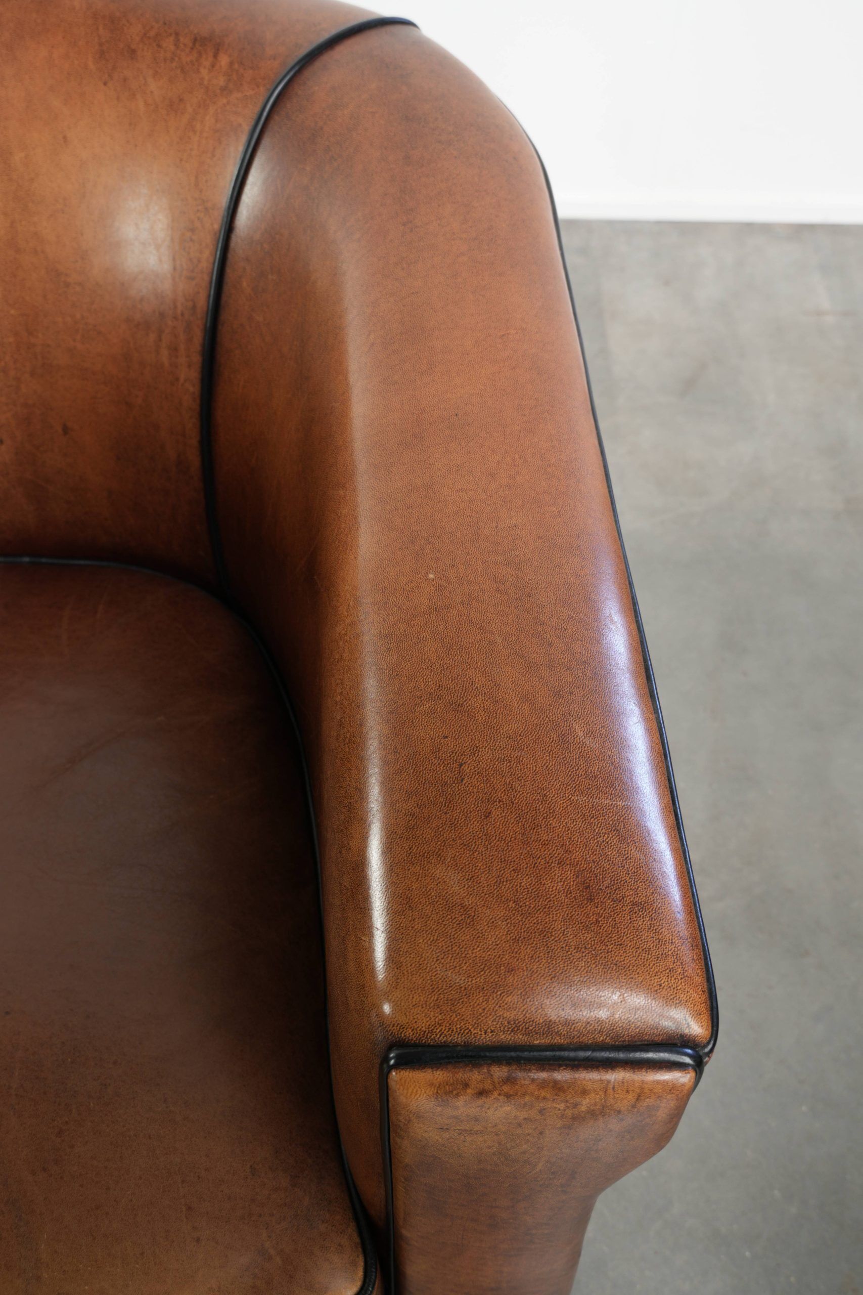 Set of two sheepskin Art Deco design club armchairs with black piping