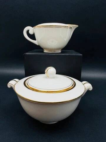 Limoges porcelain A. Vignaud sugar bowl and milk jug with gold trim