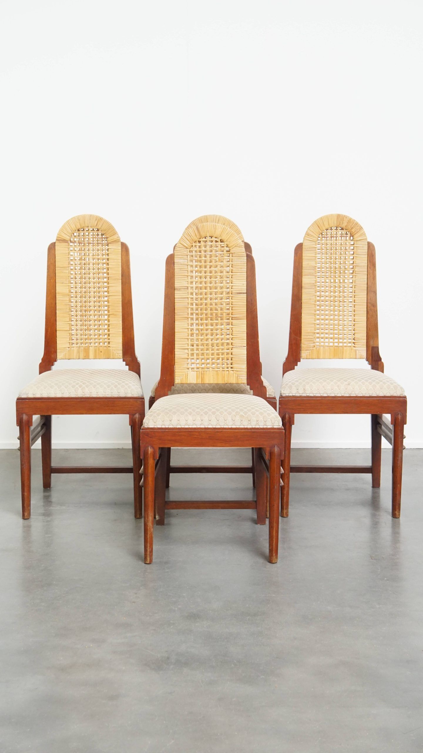4 wooden Art Deco design dining chairs with a wicker seat and backrest