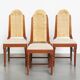 4 wooden Art Deco design dining chairs with a wicker seat and backrest