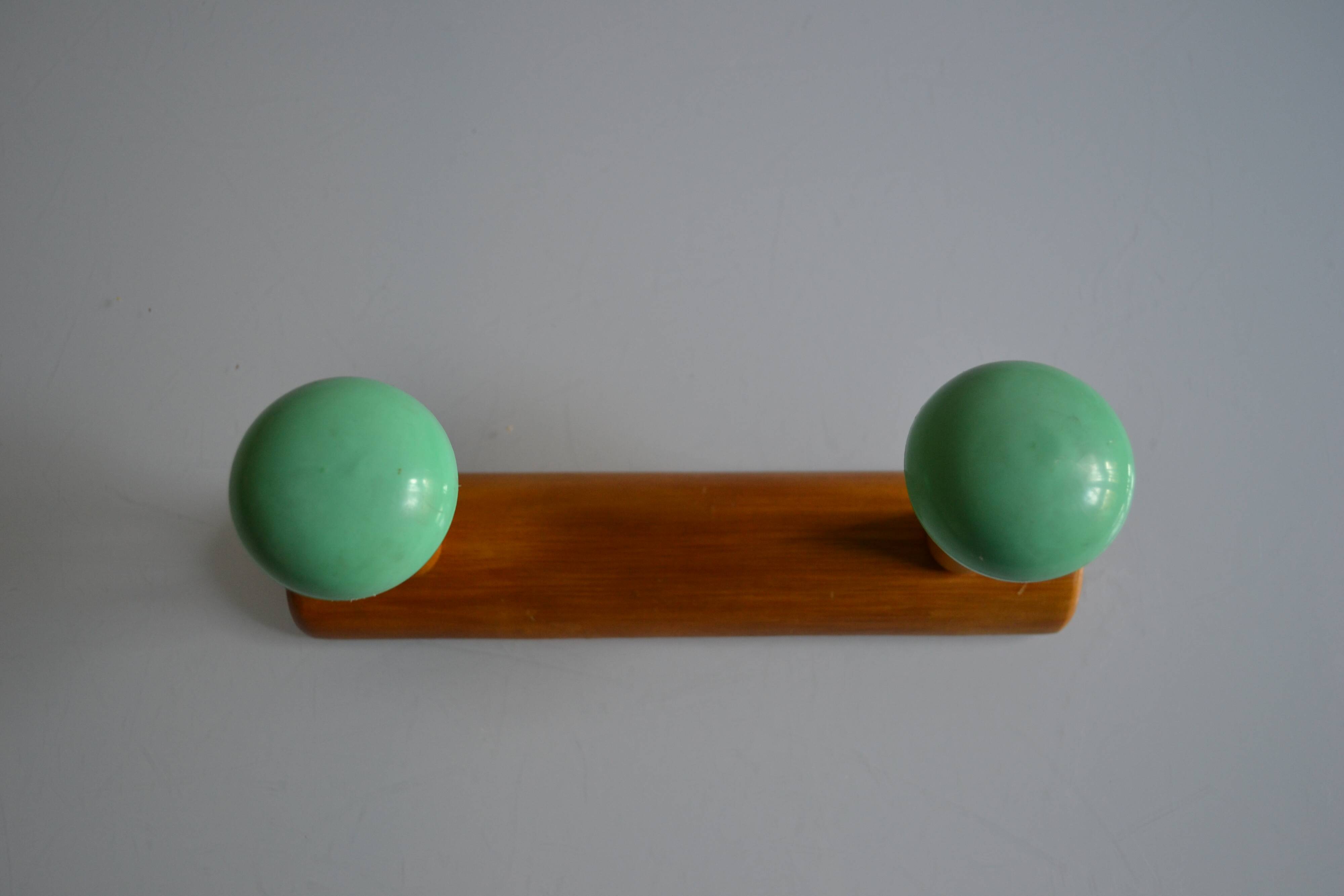 Wall coat rack with 2 hooks, wood and plastic, 60s style.