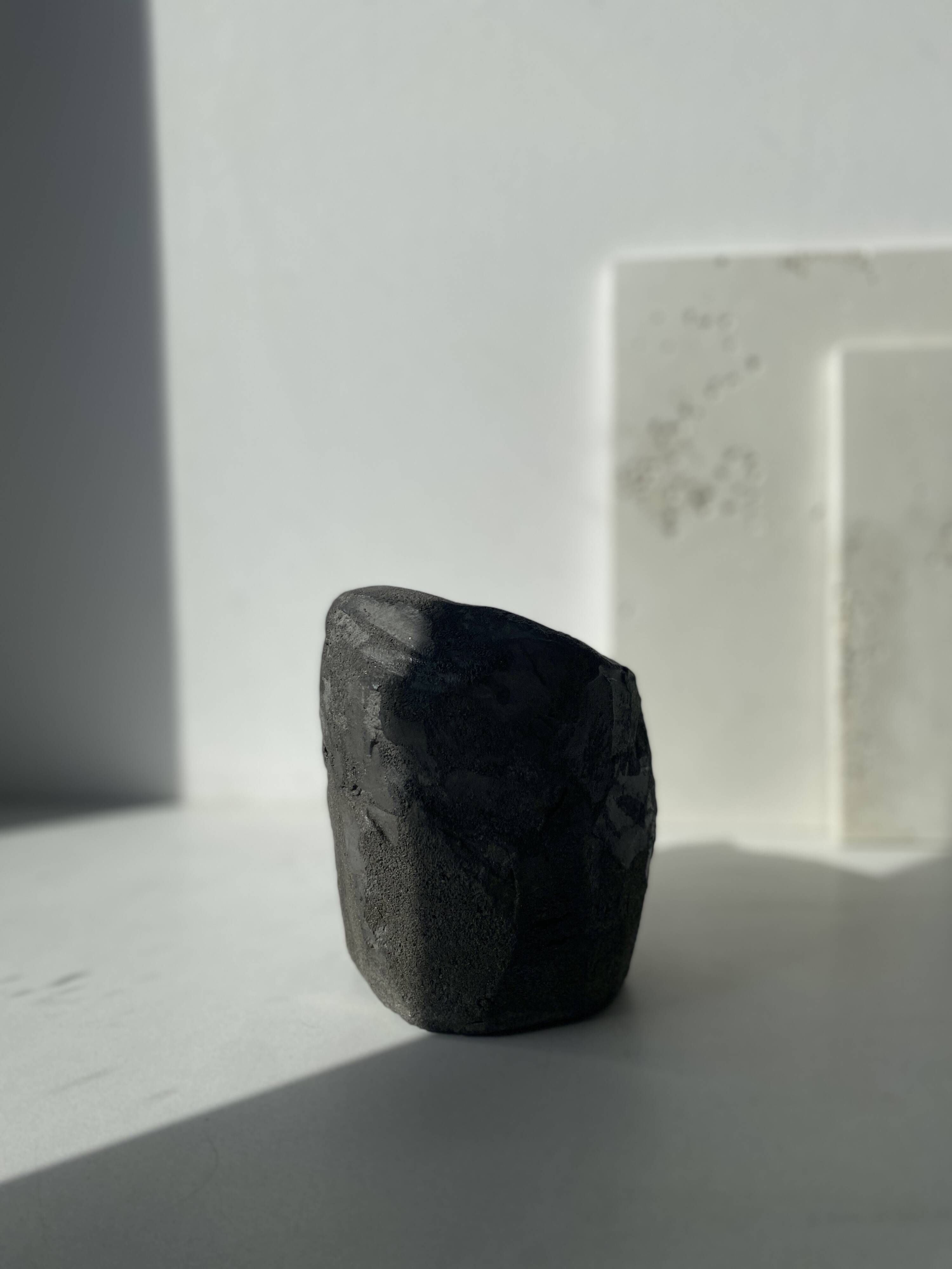 Asymmetrical sculpted concrete vase