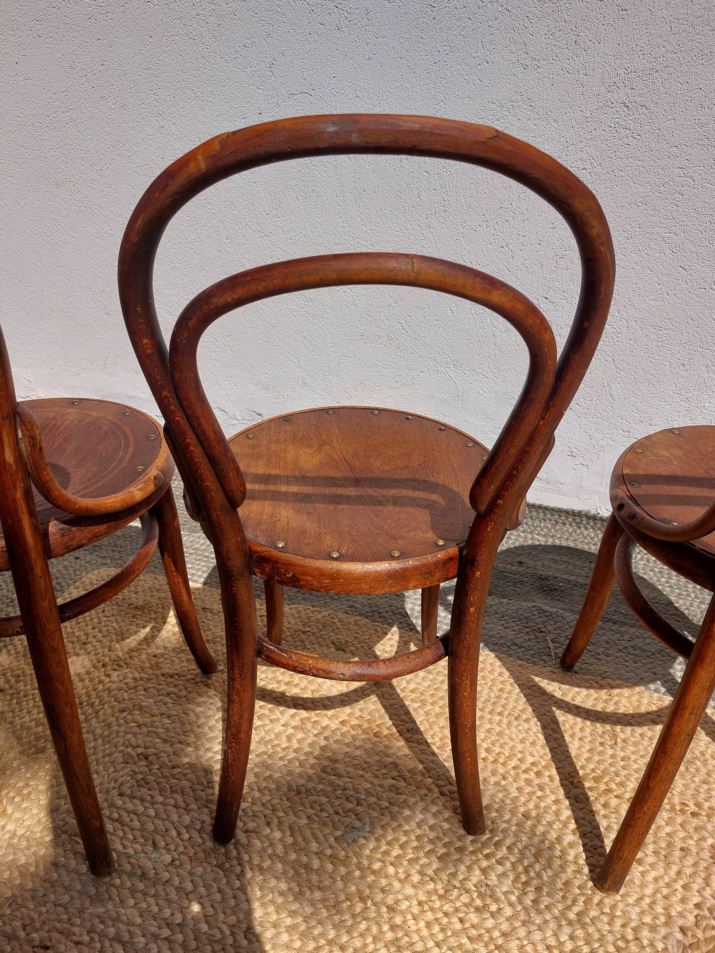 4 curved wooden bistro chairs