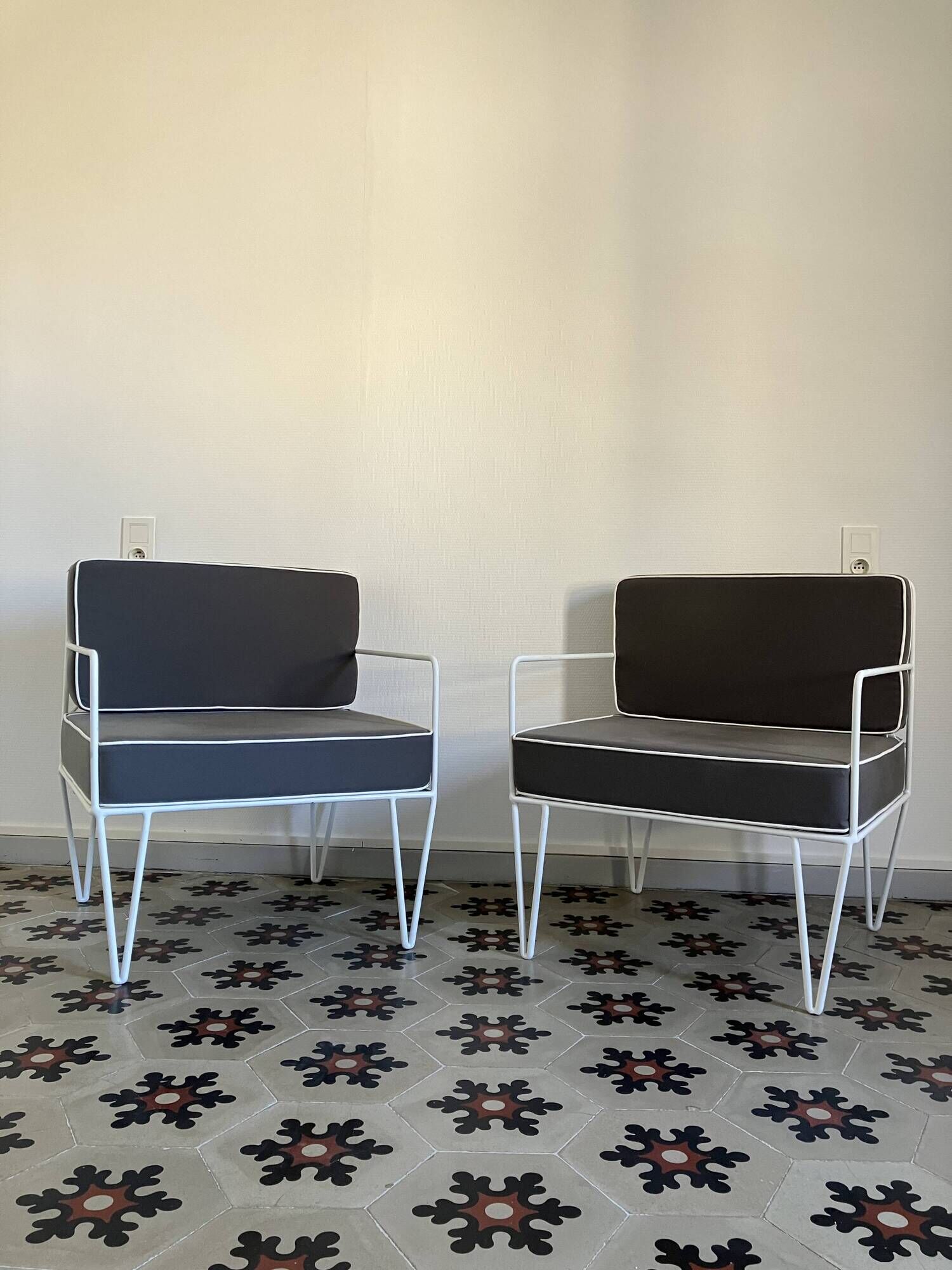 Vintage white metal Croisette style armchairs with hairpin legs in superb condition