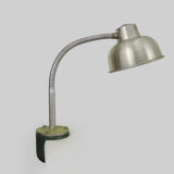 Old industrial articulated lamp with vice. Year 50