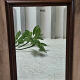 Beveled glass mirror in its wooden frame