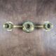 Vintage brass candle holder with 3 lights, flower drip trays, ideal for a centrepiece.