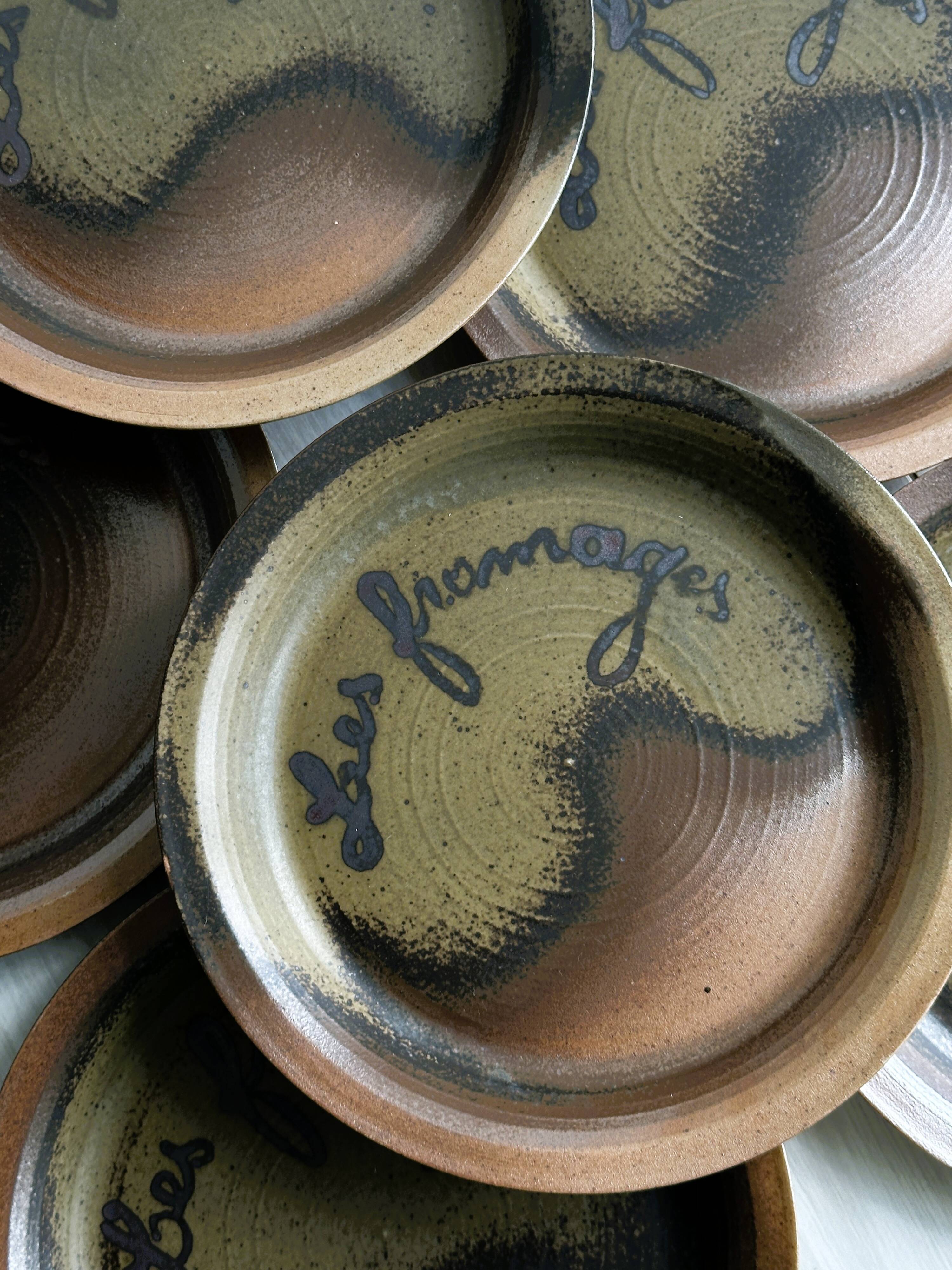 6 Arnon stoneware cheese plates.