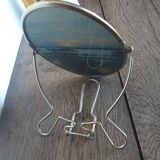 Vintage oval mirror on suspended stand