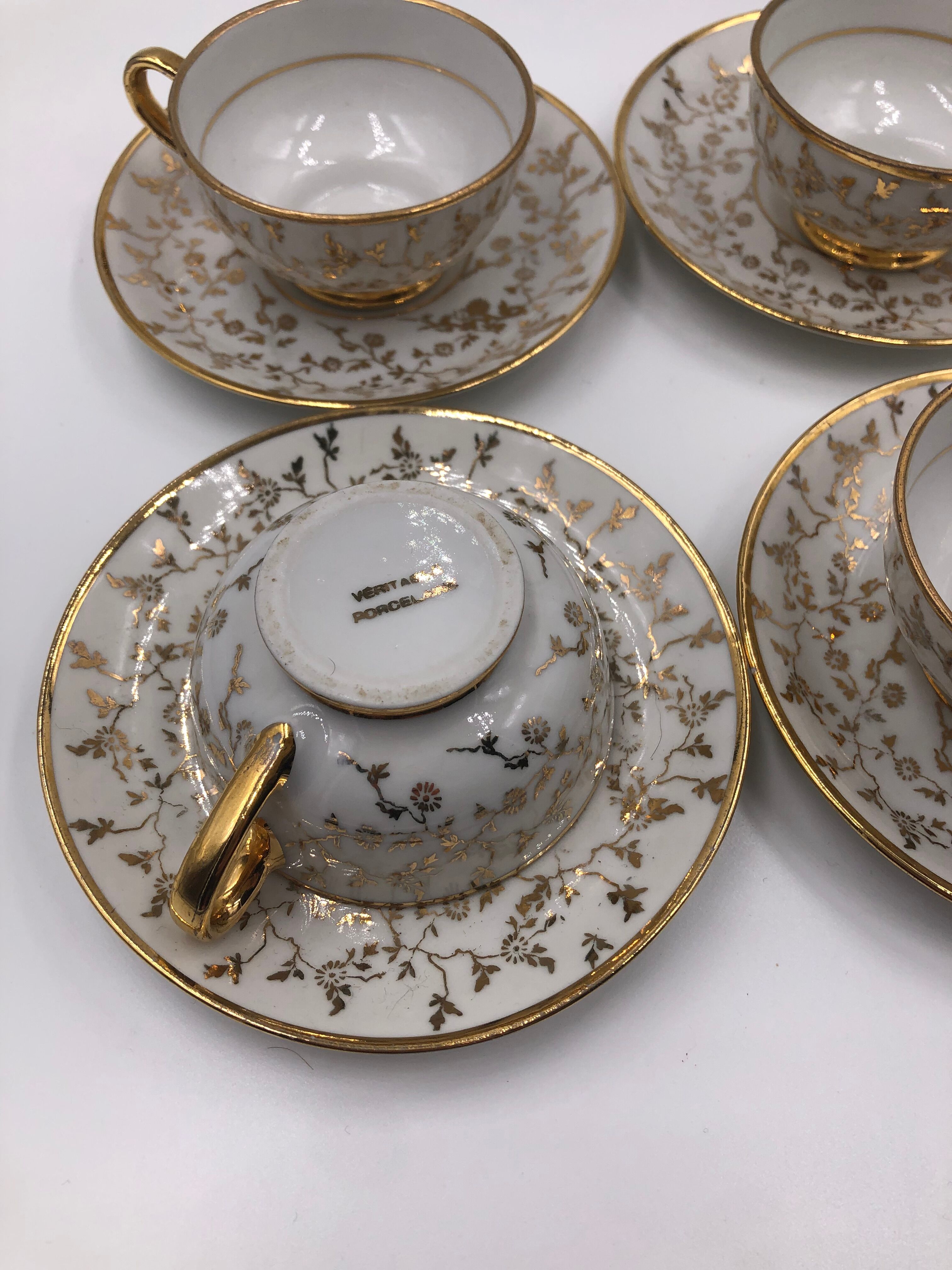 Serving together 4 cups and under cups coffee/tea flowers porcelain golden Vintage