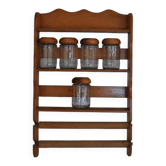 Brown wooden wall spice rack with a set of 6 glass jars, 1950s vintage style.