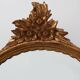 20th Century Louis XVI style giltwood mirror with ornate crest, France