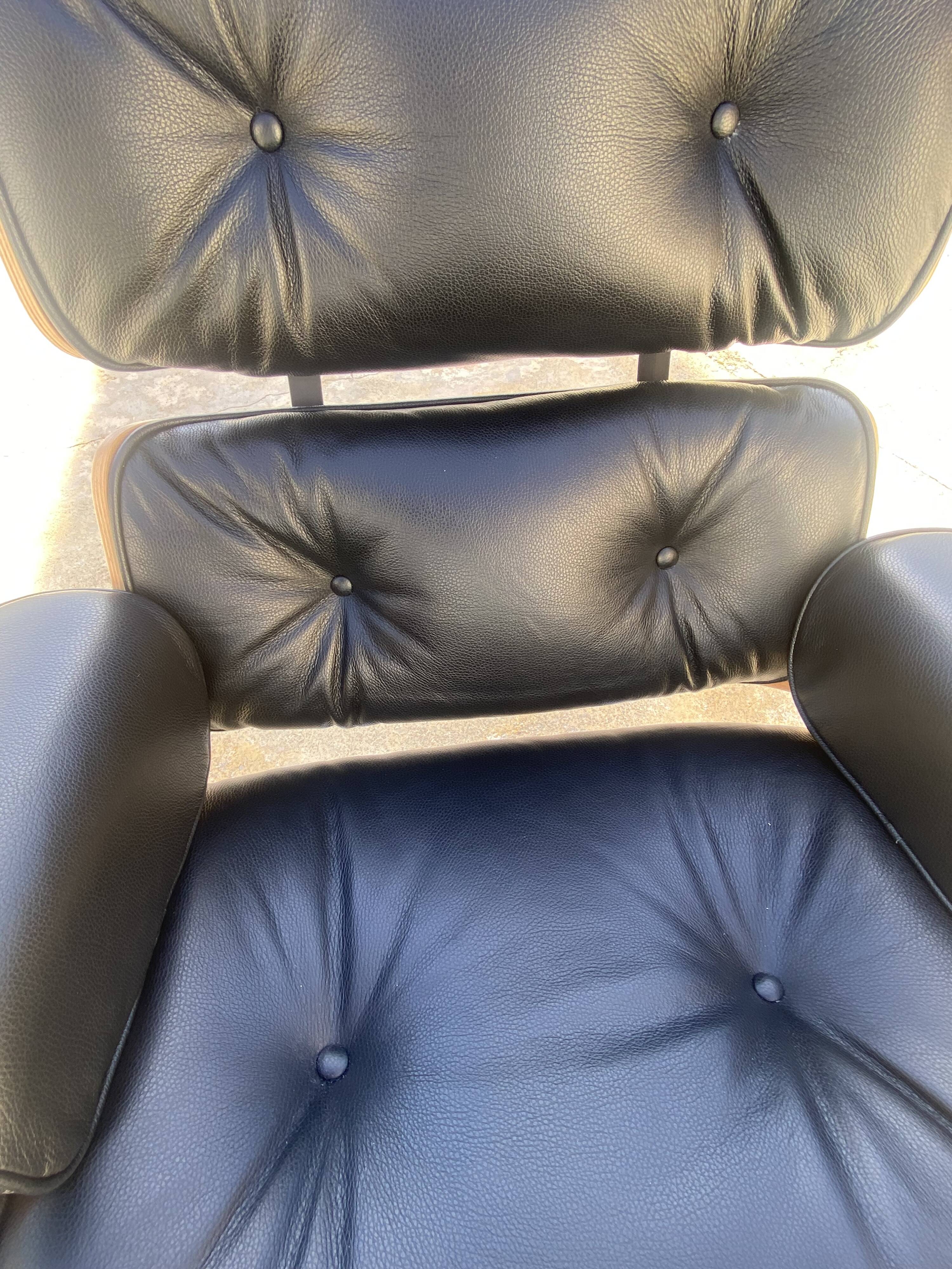 Fauteuil et Ottoman Charles Eames noir, Herman Miller, 2010