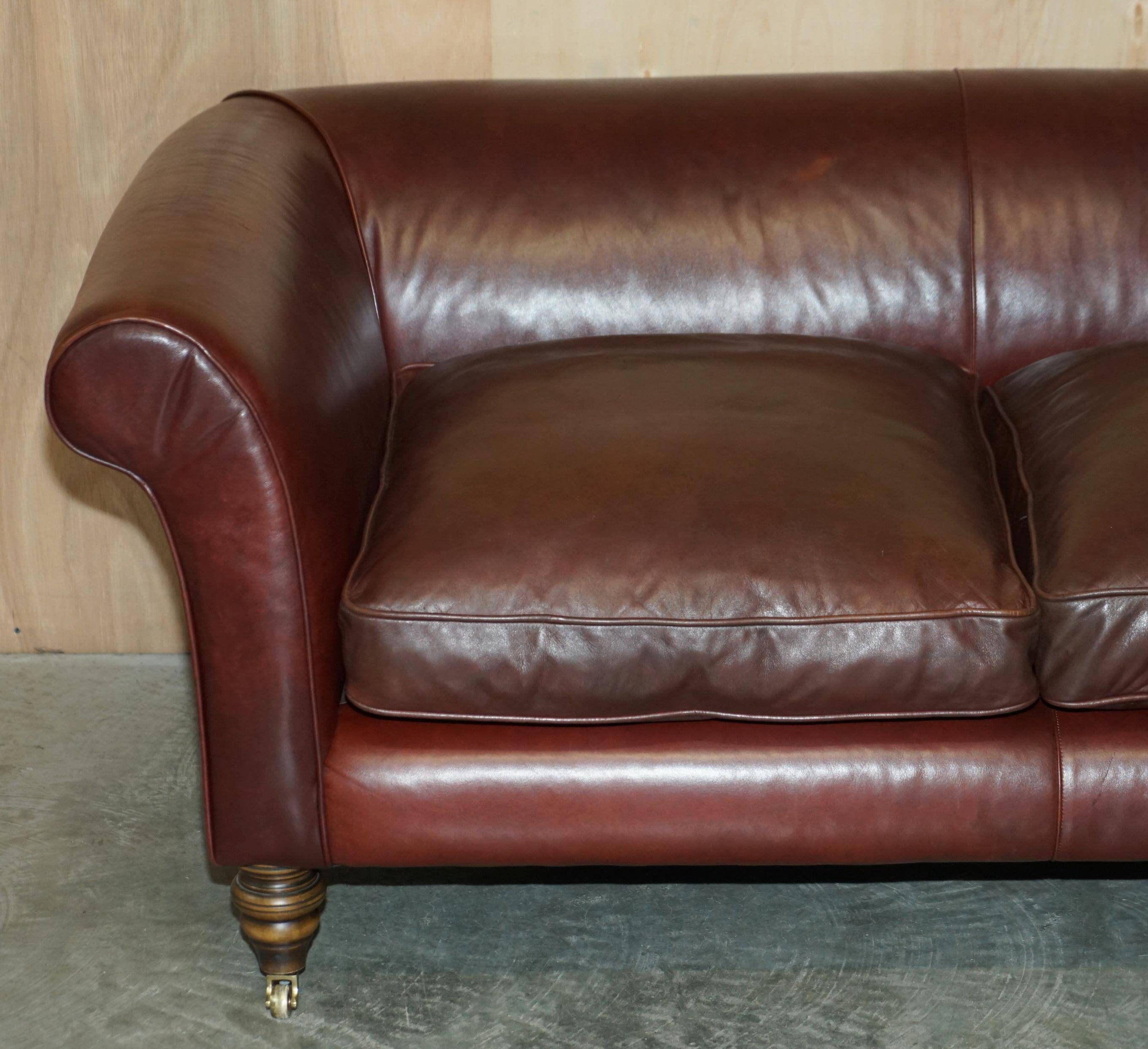Vintage Art Deco leather sofa, three-seater, feather cushions.