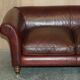 Vintage Art Deco leather sofa, three-seater, feather cushions.