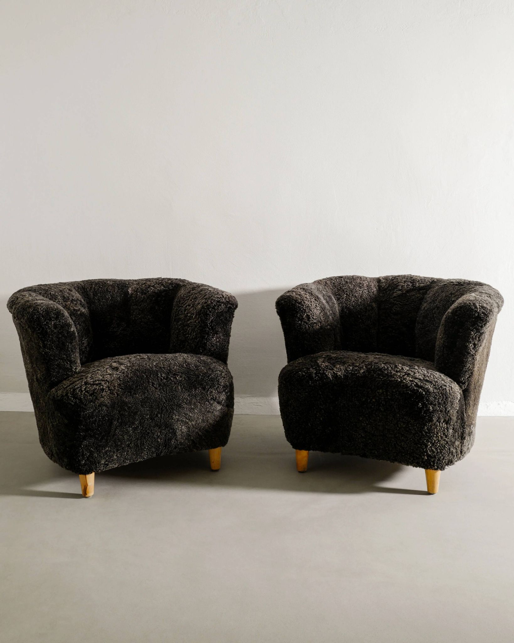 Pair of Swedish Curved Mid Century Modern Armchairs in Dark Sheepskin 1940s