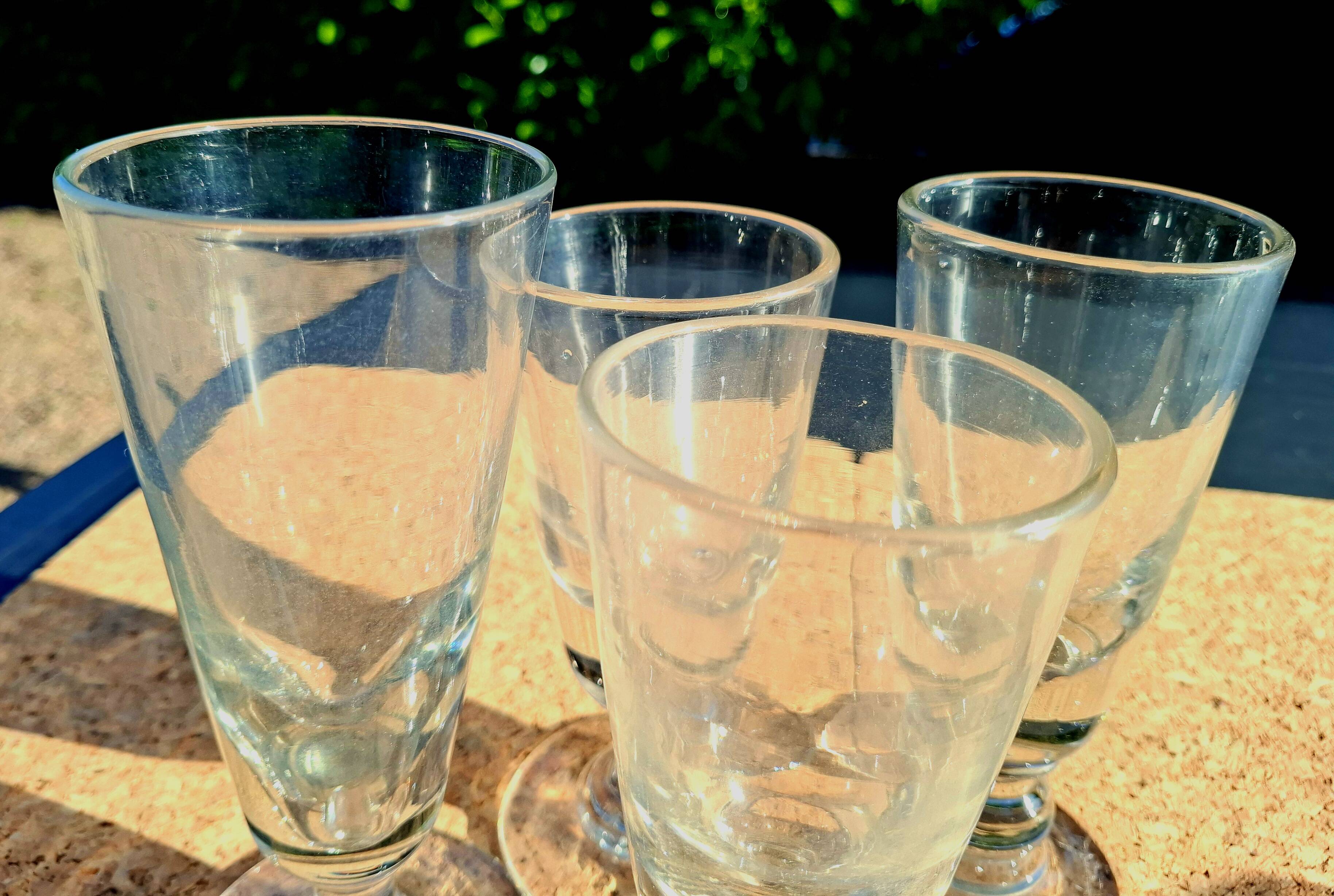 II. 4 19th century glasses (absinthe) of different heights