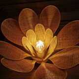 Flower table lamp made of rattan and raffia petals