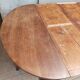 English oval table with 19th century mahogany extensions