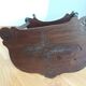 Triplet console harness in carved wood