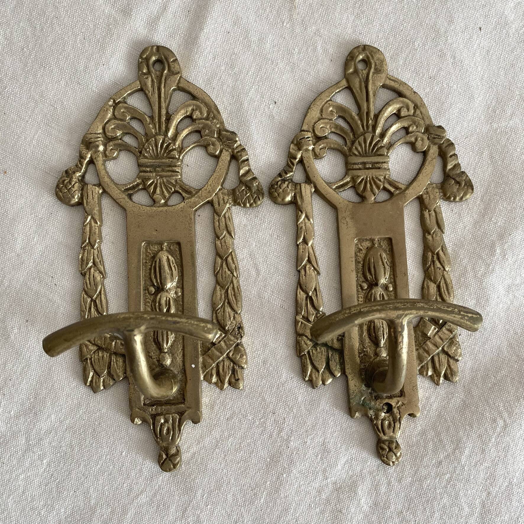 Brass coat hooks in the Napoleon III style.