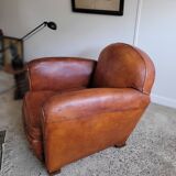 Fauteuil club en cuir patiné