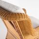 Large wicker armchair and its ottoman