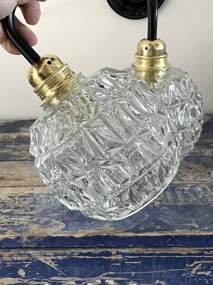 Pair of chiseled glass wall sconces