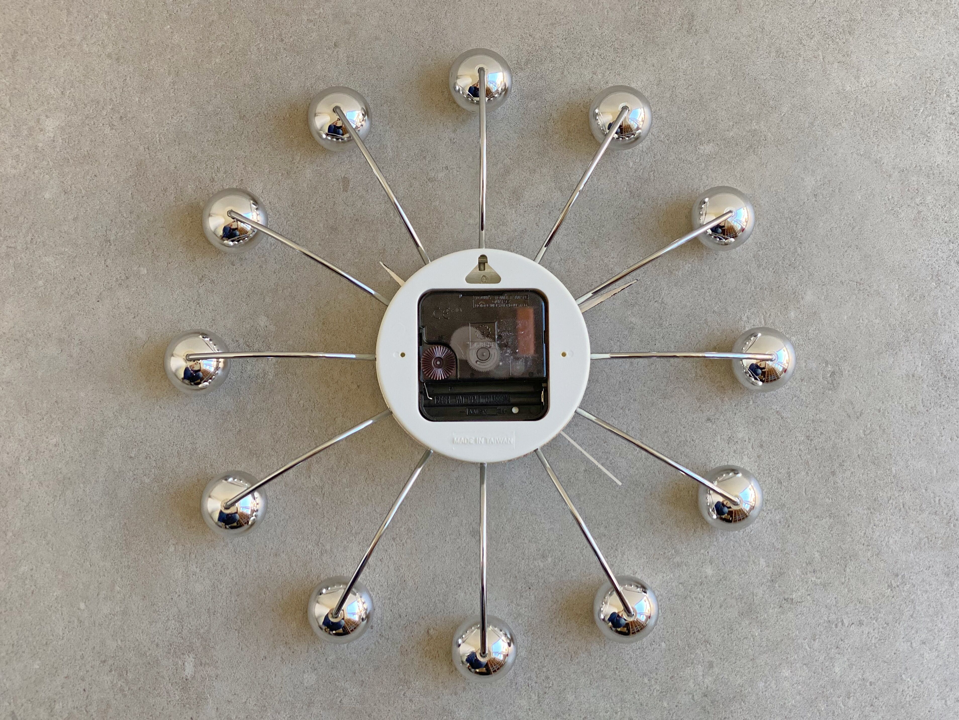 Chrome Karlsson spider wall clock with black hands, sputnik space age