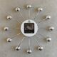 Chrome Karlsson spider wall clock with black hands, sputnik space age