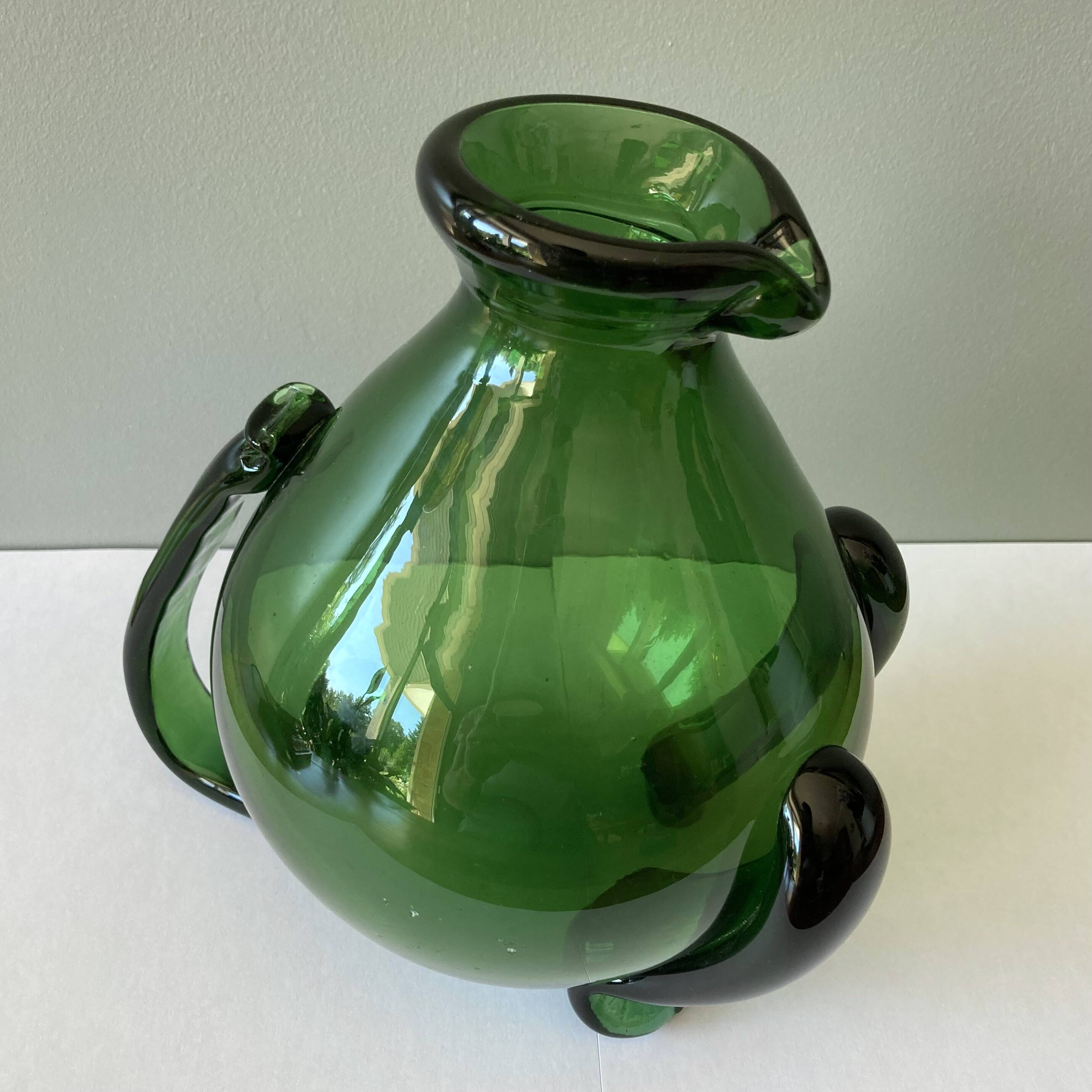 Amazing pitcher; vintage tripod jug or carafe in blown and hot-worked green glass