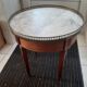 Round cherry guerion with white marble top