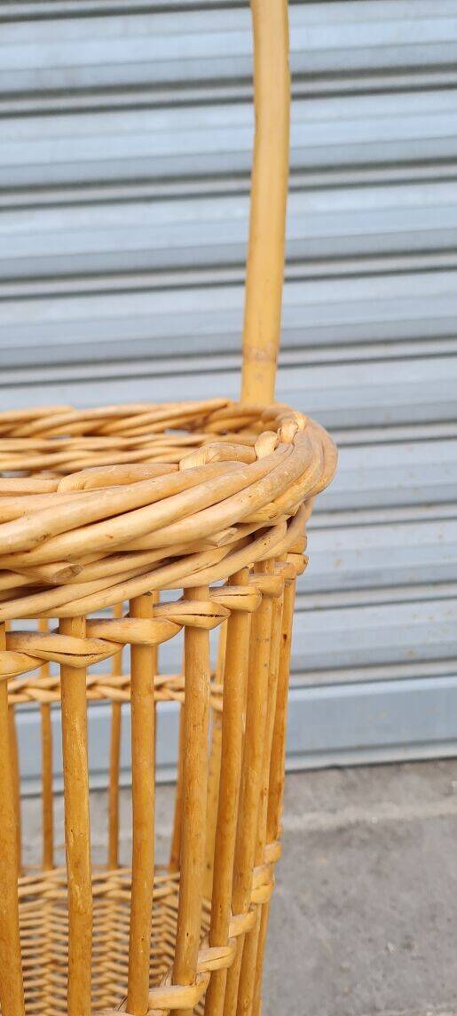 Vintage wicker log basket on vintage wheels