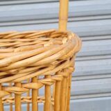 Vintage wicker log basket on vintage wheels