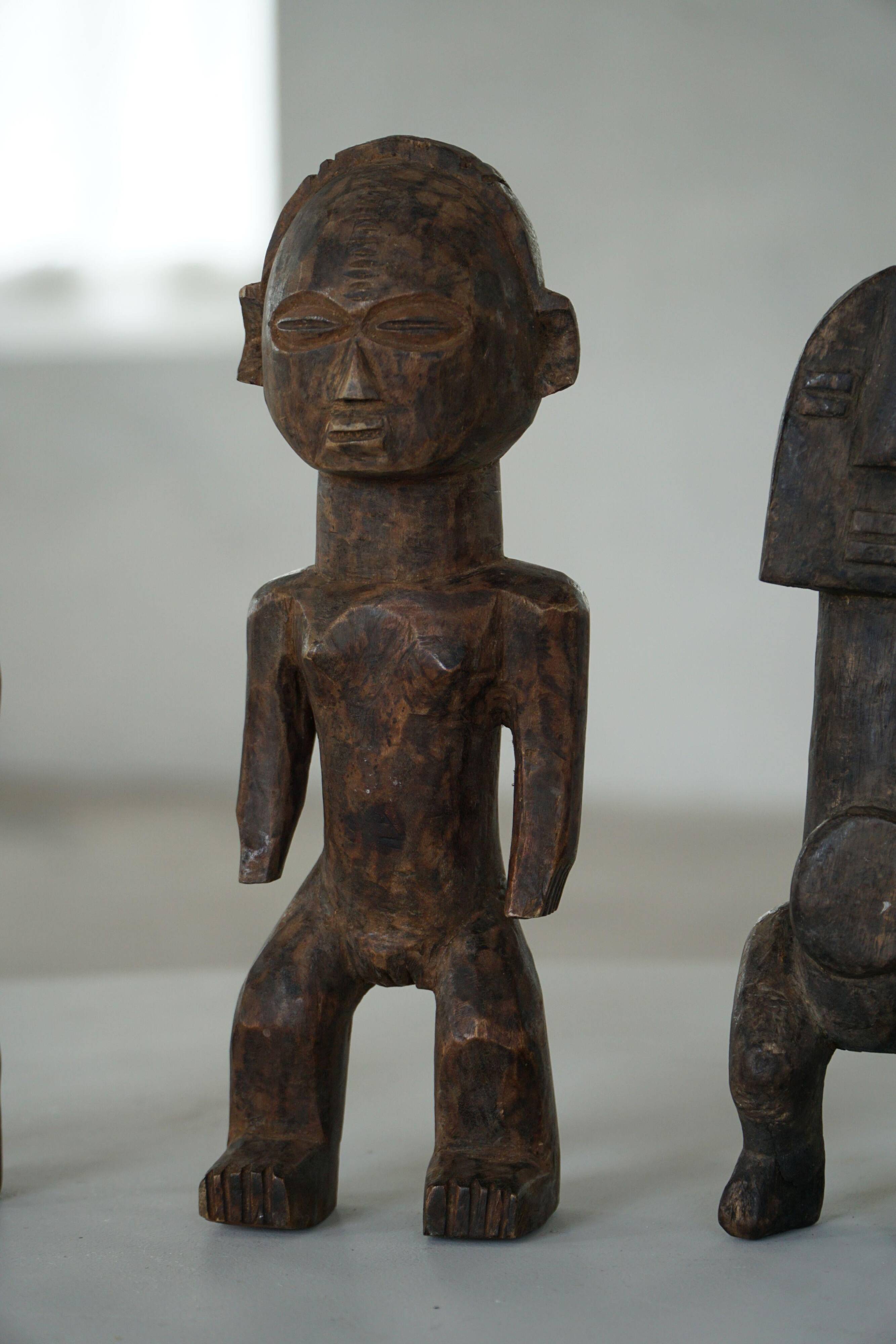 Set of 4 decorative handcrafted African wooden sculptures, mid-century.