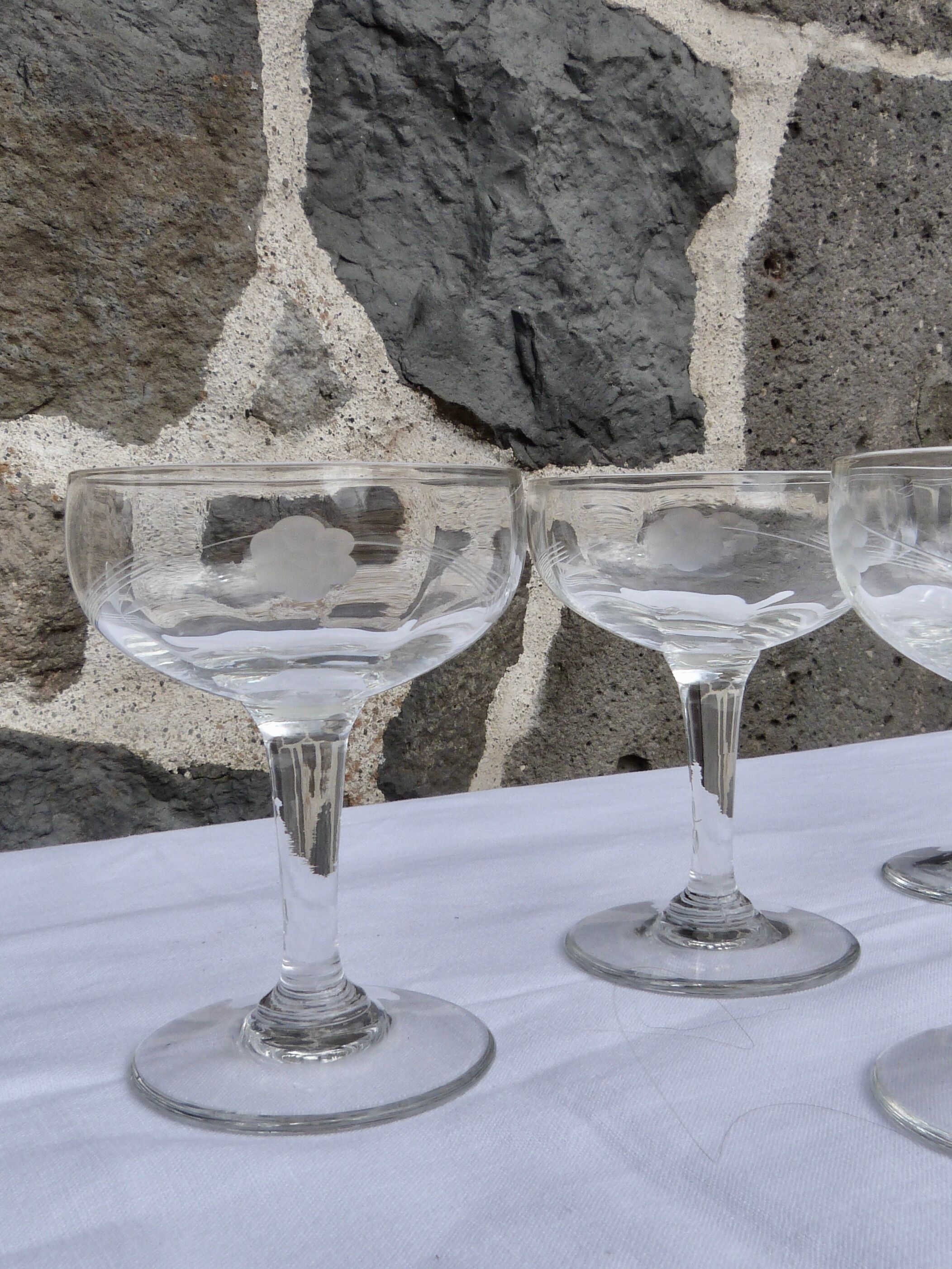 Set of 11 carved glass champagne glasses