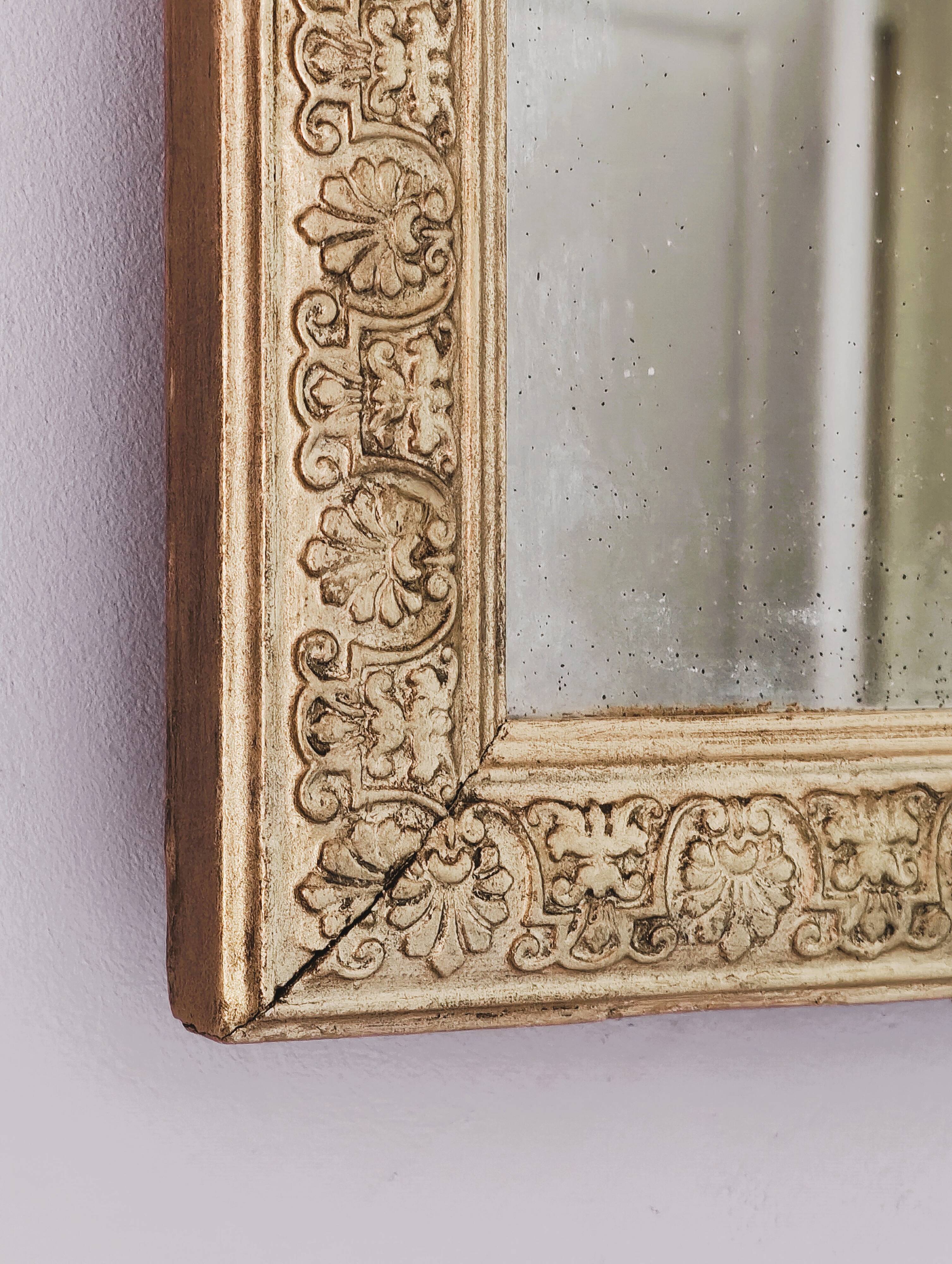 Rectangular wooden mirror with ornate Art Nouveau gold finish.