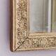 Rectangular wooden mirror with ornate Art Nouveau gold finish.