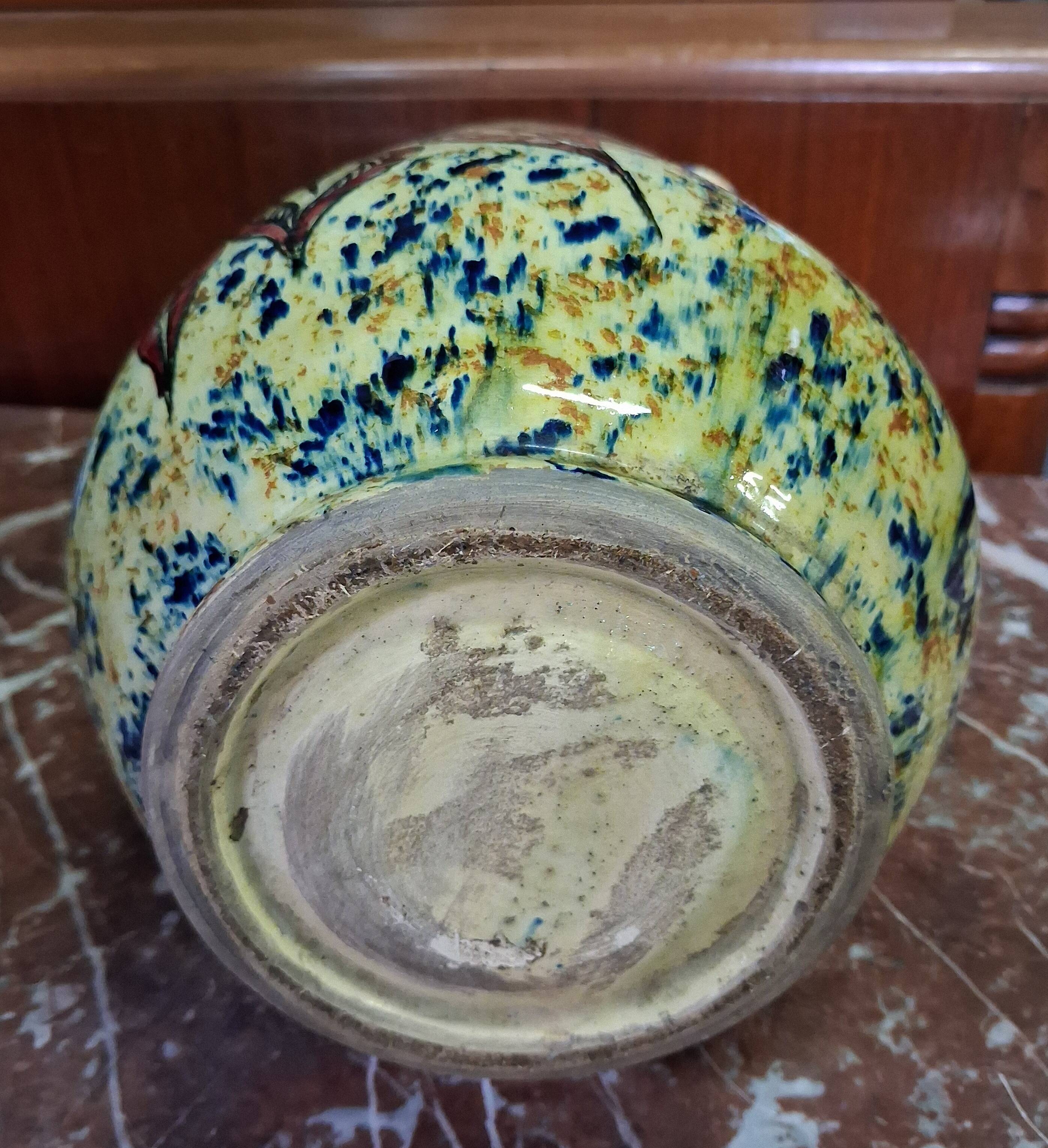 polychrome floral-decorated jug in glazed ceramic