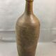 Old bottle in varnished sandstone glazed vintage